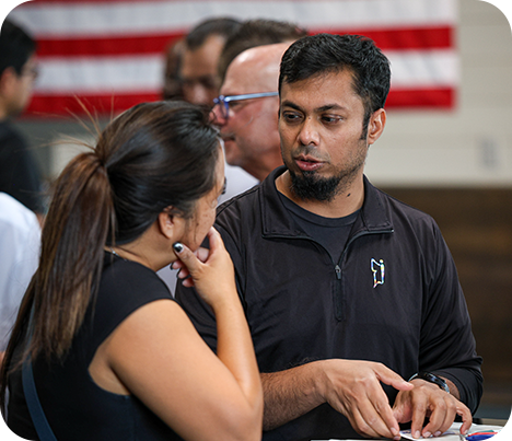 Conference speaker engaging with an audience
